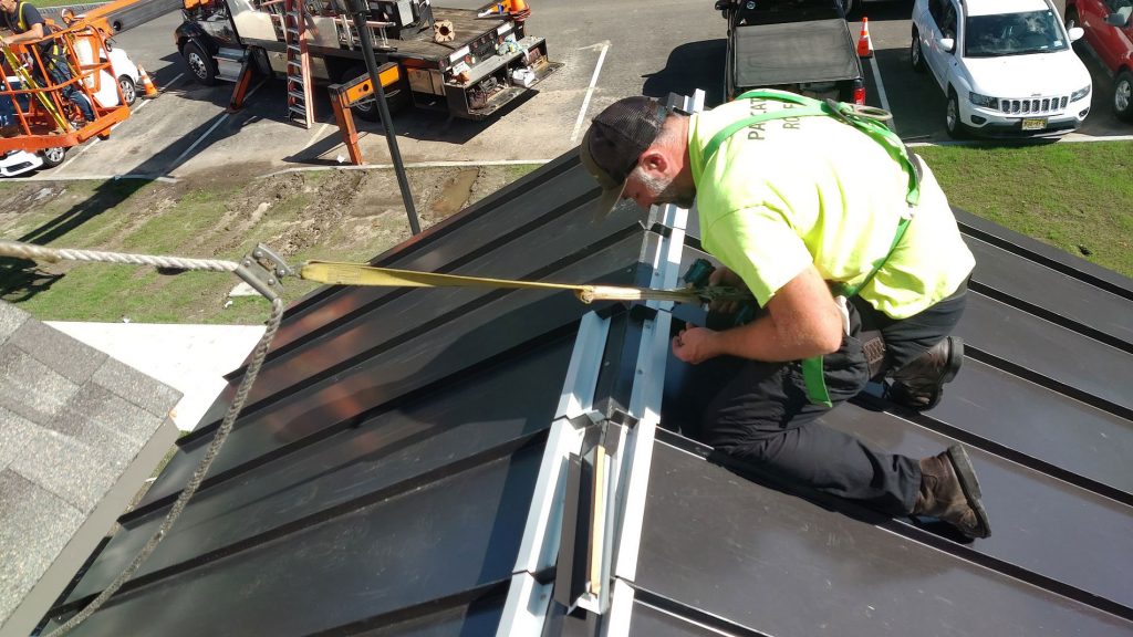 Metal roof contractor working for pawcatuck roofing company